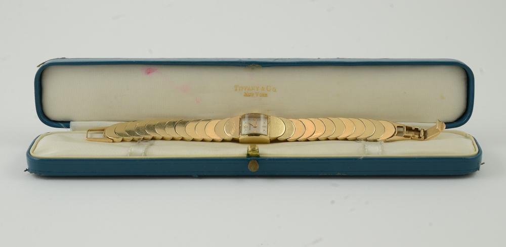 Ladies 14K Tiffany & Co. Gold Wristwatch: Mid 20th Century, Case and Band marked 14K. Watch sets and winds, but does not run. 6.5" band. normal marks from light use. Works stamped Concord Watch Co. Back of case engraved and presented 195