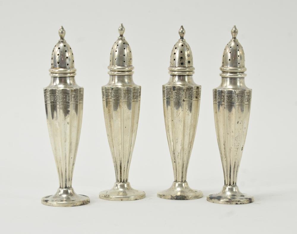 Regency Sterling Silver Salt & Pepper shakers: Four matching shakers. Hallmark of J. Wagner and Son, stamped 1895, retailed by William Wise & Son, Each 5.5" tall, total weight: 4.2 OZT. good condition.