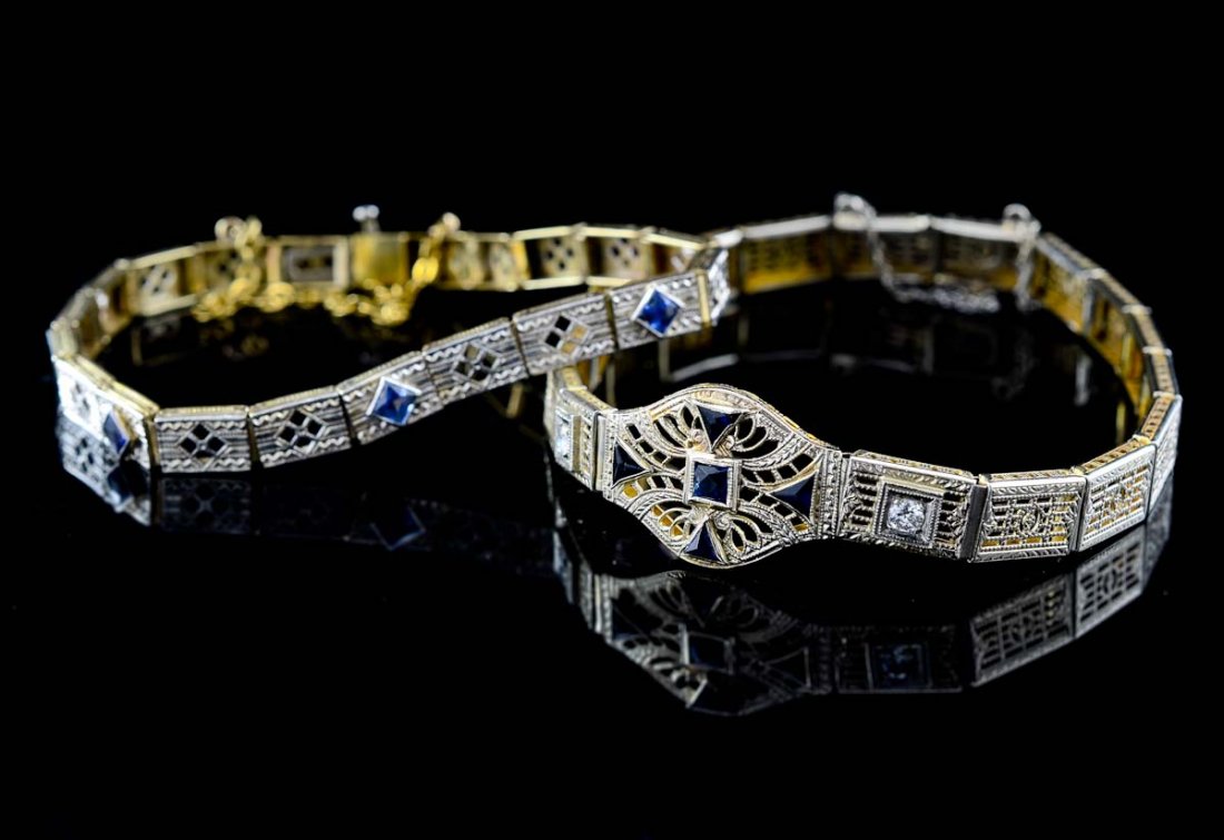 Two Ladies Gemstone Bracelets: Each 14K, Victorian Style link bracelets. Late 19th or early 20th Century. The first a yellow gold filigree design with deep blue sapphires, flanked by round cut diamonds. 7" Diameter, overall very go