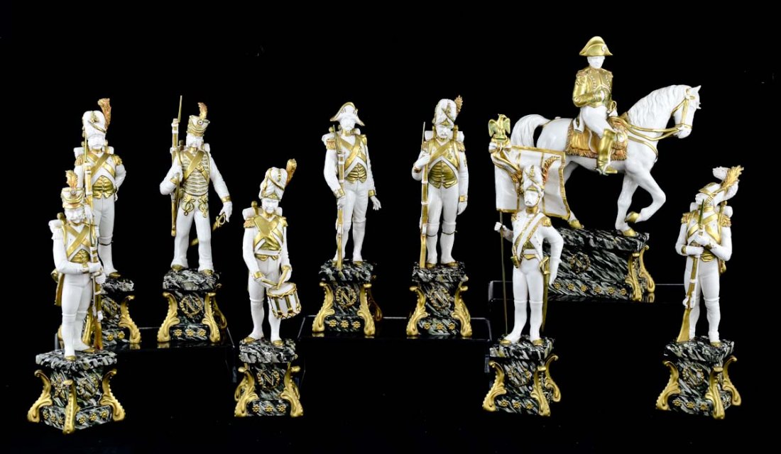 Napoleonic Porcelain Group: Guido Cacciapuoti, Italian 1892-1953, Signed on the bases, Made in Italy White Porcelain with overglaze gilt and paint decoration. This group depicts Emperor Napoleon on horseback (14" x 10" ) with 10