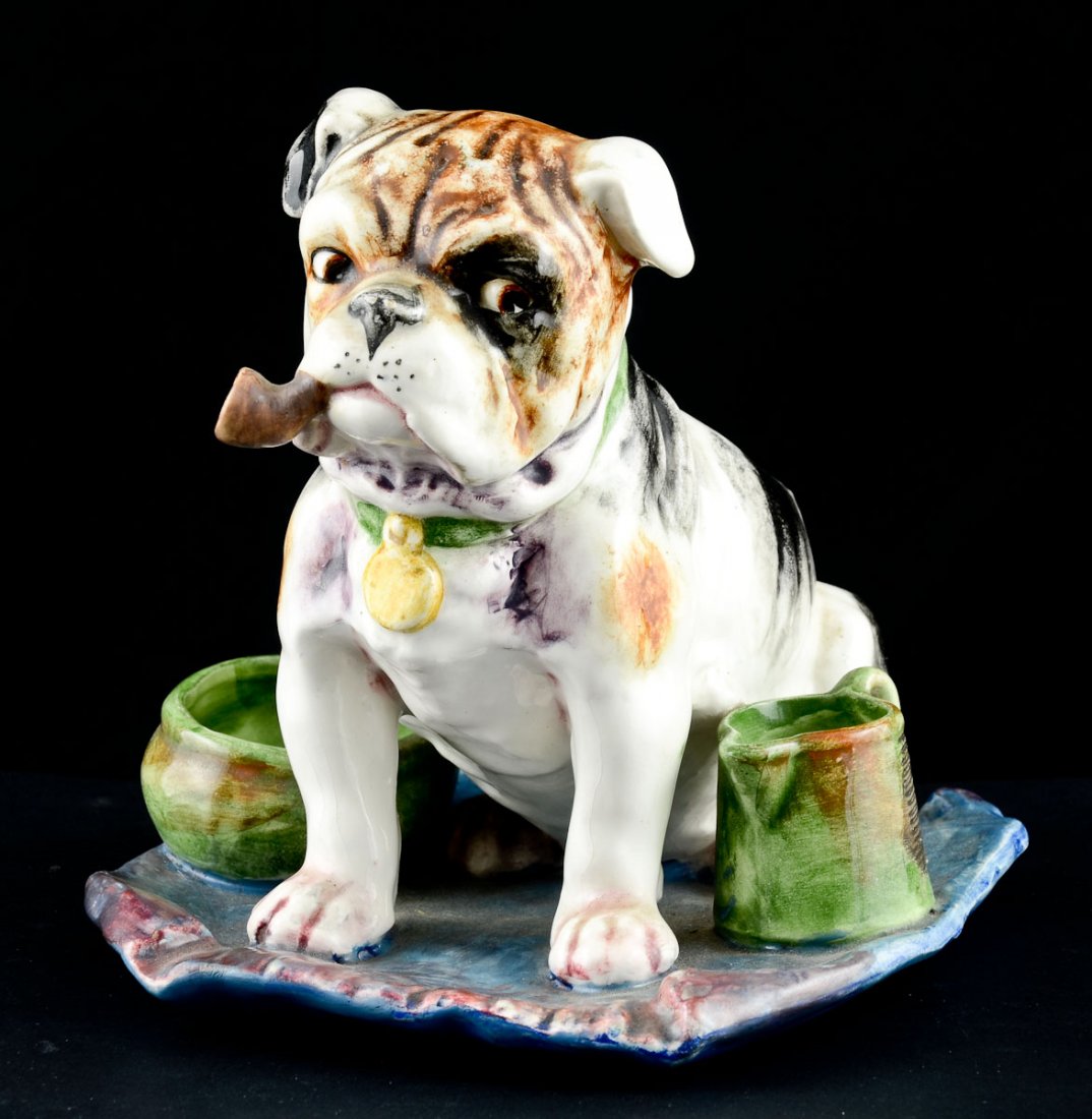 Majolica bulldog match strike: Smoking stand and match strike with Pipe smoking bulldog on a mat with bowl and pitcher. Says Austria and is numbered 8133 on the bottom, 7 1/2"h x 7 1/2" x 8"d. No chips or visible repairs, some crac