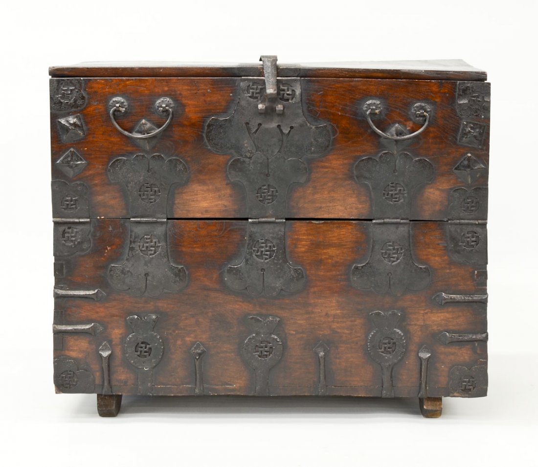 Earlier Asian Bandaji Chest: Chinese or Korean Wooden chest with Wrought Iron hinges and pulls. 19th Century or earlier. Good condition with signs of age. Old repair done on the top has resplit. Missing pin for the clasp. Opens o