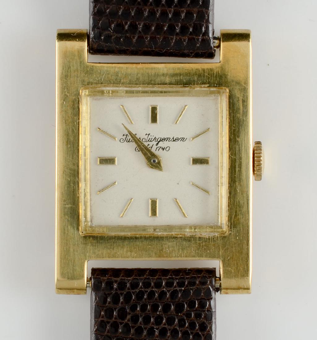 Men's 18k Jules Jurgensen Wrist Watch: Case marked 18K, 750. square face, leather band. winds and runs. 20mm face. overall very good vintage condition