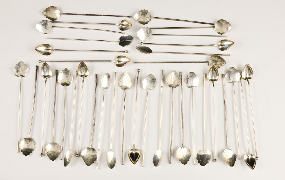 Sterling Silver Mint Julep Spoons: 35 julep spoons marked .925. Circa mid 20th century. Taxco Mexico and Wallace Silversmiths Heart pattern. some pieces bent Spoons measure around 8" long. Some tarnishing and scratches. Total weight is