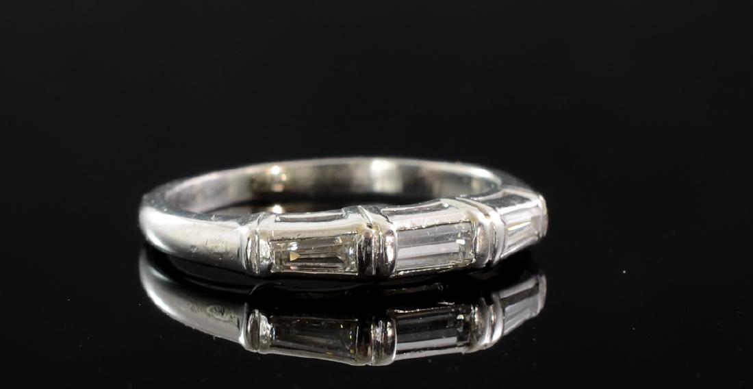 Ladies Platinum Diamond Wedding Band: second half 20th century. approximately .3 CTW baguette diamonds, size 4.75, 3.3 g / 2.2 dwt total. minor wear from gentle use, no damage.