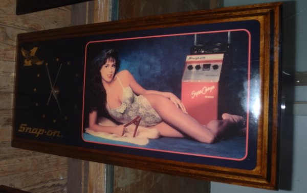 snap on tools clock with calendar girl: snap on tools battery operated clock has calendar girl with battery charger