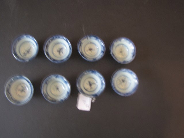 8 Oriental blue and white cups: All signed