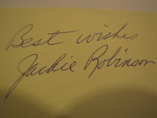 Cut album page signed by Jackie Robinson: Cut album page signed by Jackie Robinson in blue ink. "Best Wishes Jackie Robinson" item has been certified by Autograph Certification Experts.