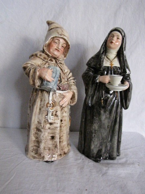 Pair of Majolica porcelain figurine bells: Pair of Majolica porcelain figurine bells, 11" tall, nun & monk