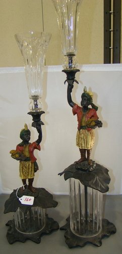 PAIR OF COLD PAINTED BRONZE BLACKMOORS: One approximately 24"tall, the other approximately 34" tall, each sitting on a French crystal cylinder with crystal epergne flutes, buyer arranges shipping, we can recommend local shipper.