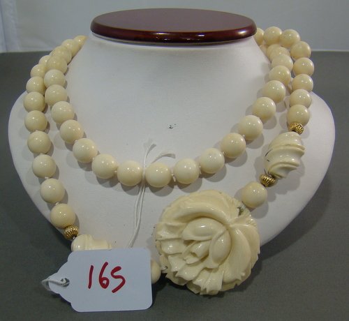 LARGE CARVED VINTAGE IVORY NECKLACE: Approx 32" with 10mm carved ivory beads, great floral pendant with 14kt gold seperation balls, buyer arranges shipping, we can recommend local shipper, this item is not available for export.
