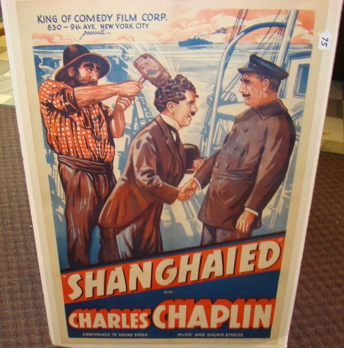 CHARLES CHAPLIN EARLY SILENT MOVIE POSTER: Great lithographic print depicting the 1915 silent movie starring Charlie Chaplin titled "Shanghaied", originally printed by Morgan Litho. Corp in Cleveland, OH; poster #20220, linen backed, measures: