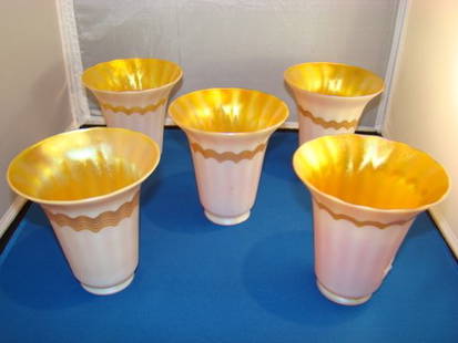 SET OF FIVE VINTAGE QUEZAL SHADES: Each approx. 7" tall, in a gold favrile style interior, with cream and gold exterior, four shades in relative excellent condition, the fifth has small hairline, each signed Quezal to inside rim, buyer