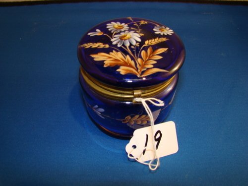 VINTAGE COBALT & ENAMELED LADIES DRESSER BOX: Approx. 4" in diameter and 4" tall, with heavy raised enameling of Daisies, small loss to hinge, buyer arranges shipping, we can recommend local shipper.