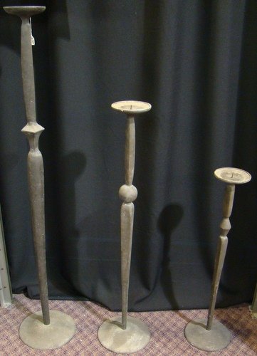 GRADUATED SET OF WROUGHT IRON CANDLESTICKS: Graduating in size; one 2ft, one 3ft, and one 4ft candlestick, buyer arranges shipping, we can recommend local shipper.