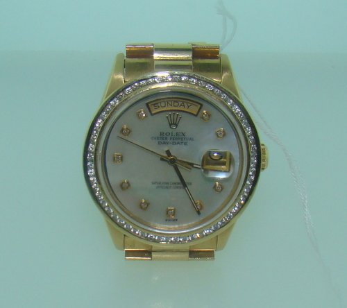 MENS ROLEX DIAMOND DIAL PRESIDENTIAL WATCH: 18kt heavy Yellow Gold, with lovely aftermarket Diamond bezel, Mother of Pearl dial with Diamonds for numbers, recently serviced, no box or papers, no stretch to band, in excellent condition, shipping