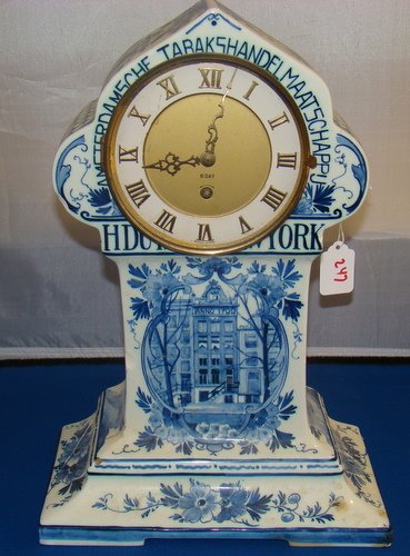 19TH CENT. LARGE DELFT PORCELAIN CLOCK: Approx. 14" tall by 10" wide, numerous cracks and chips with age, not in working condition, sold as is, buyer arranges shipping, we can recommend local shipper.