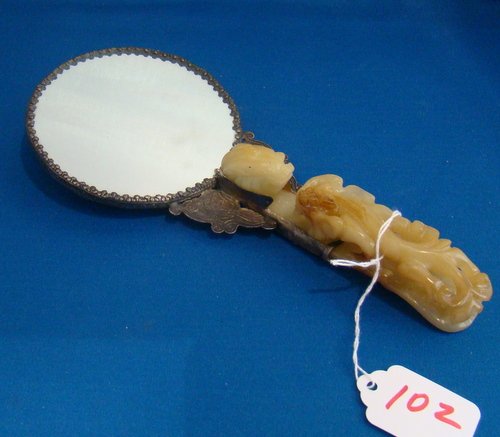 19TH CENTURY ORIENTAL SILVER & JADE HAND MIRROR: Approx. 9" long, with Dragon motif, with White Jade carved Dragon handle, in excellent condition, circa 1870's, buyer arranges shipping, we can recommend local shipper.