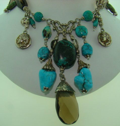 VINTAGE STERLING & TURQUOISE NECKLACE: Approx. 18" long, with multi colored Turquoise and Ebony stones, circa 1940's, shipping fee will be added to invoice.