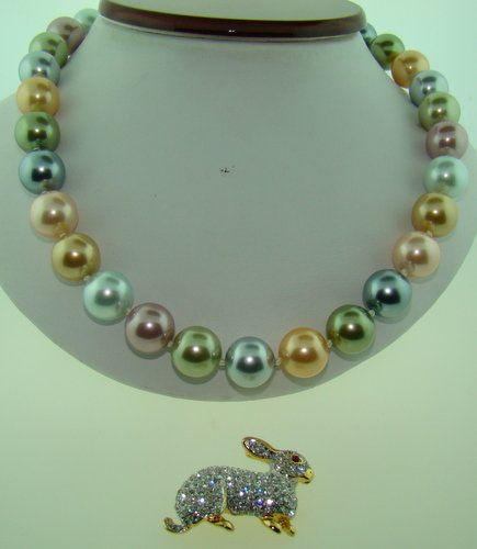 2PIECES OF VINTAGE KENNETH LANE JEWELRY: Rhinestone Bunny, and a Multi Colored Pearl necklace, circa 1950's, in excellent condition, shipping fee to be added to invoice.