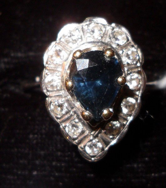 DIAMOND AND SAPPHIRE LADIES COCKTAIL RING: DIAMOND AND SAPPHIRE LADIES COCKTAIL RING size 8; approx 1.25 ct sapphire center stone; 1 ct of accent diamonds on 14kt white gold