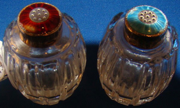 DANISH ENAMELED SALT AND PEPPER SHAKERS: DANISH ENAMELED SALT AND PEPPER SHAKERS Approx 2" tall one red one blue, enamel over sterling tops crystal bottoms signed Meka sterling Denmark