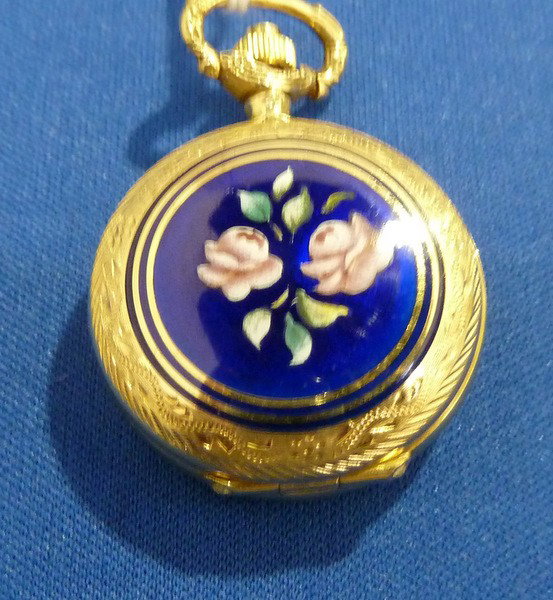 ANTIQUE 18 KT GOLD GENEVE ENAMELED POCKET WATCH: ANTIQUE 18 KT GOLD GENEVE ENAMELED POCKET WATCH approx. 1 1/2" diameter; in fabulous working condition We can recommend local shippers