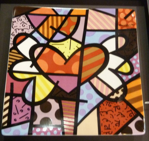 ROMERO BRITTO DESIGNED PLATE: ROMERO BRITTO DESIGNED PLATE signed & dated 1976; mounted and framed We can recommend local shippers