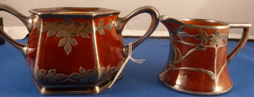 LENOX BELLEEK SILVER OVERLAY CREAMER & SUGAR: LENOX BELLEEK SILVER OVERLAY CREAMER & SUGAR stained brown;with heavy silver overlay;creamer being 3" tall sugar sans lid;excellent condition