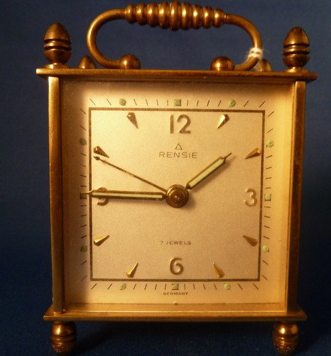 VINTAGE GERMAN CARRIAGE CLOCK: VINTAGE GERMAN CARRIAGE CLOCK approx 3" tall with mother of pearl inlay;by Rensie;7 jeweled movement;working condition we can recommend local shippers