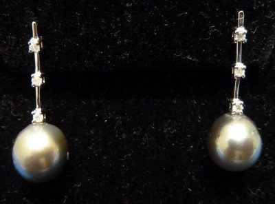 TAHITIAN PEARL AND DIAMOND EARRINGS: TAHITIAN PEARL AND DIAMOND EARRINGS pearls approx 8mm with three diamond accents;drop approx 1";14kt white gold we can recommend local shippers