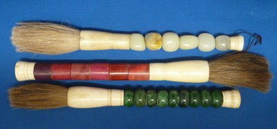 SET OF THREE JADE & CORAL CALLIGRAPHY BRUSHES: SET OF THREE JADE & CORAL CALLIGRAPHY BRUSHES approx 11" each;with horsehair tips we ca recommend local shippers