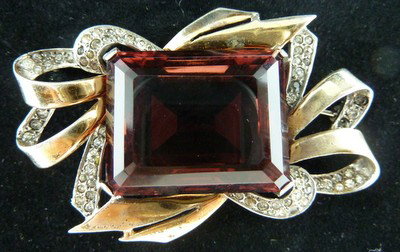 MARCEL BOUCHER COSTUME AMETHYST PIN: MARCEL BOUCHER COSTUME AMETHYST PIN with the first MB chicken head mark;approx 3" long we can recommend local shipper