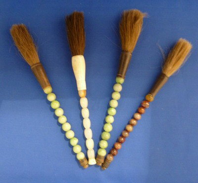 FOUR SMALL JADE BONE & HORSEHAIR CALLIGRAPHY BRUSH: FOUR SMALL JADE BONE & HORSEHAIR CALLIGRAPHY BRUSHES each approx 10" long we can recommend local shipper
