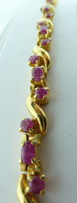 STERLING AND RUBY BRACELET: STERLING AND RUBY BRACELET approx 7" long;gold washed;2ct of rubies we can recommend local shippers