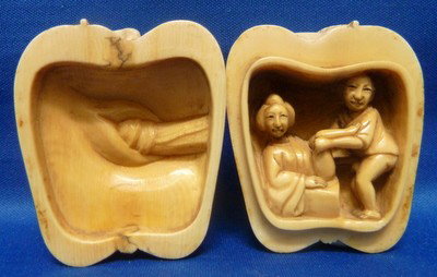 ANTIQUE IVORY SCRIMSHAW APPLE EROTICA: ANTIQUE IVORY SCRIMSHAW APPLE EROTICA approx 2" tall;opens into a carved penis and vagina and couple making love we can recommend local shippers