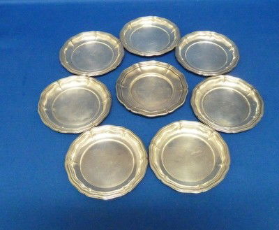 EIGHT STERLING BUTTER TRAYS: EIGHT STERLING BUTTER TRAYS each approx 3.5" diameter;marked sterling;total weight approx 6 ounces we can recommend local shippers