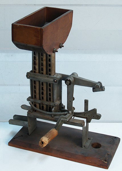 Early Countertop Hank-Crank Penny Machine: Early Countertop Hank-Crank Penny Machine. Used to insert Pennies into cigarette packs in the 1940's