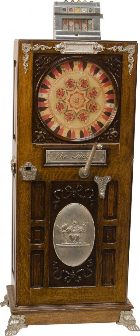 5 Cent Mills "The Judge" Upright Floor Slot Machin: 5 Cent Mills "The Judge" Upright Floor Slot Machine - Paper wheel - Ornate wood & silver design detailing, rotating crank handle, c1899 - 63"h