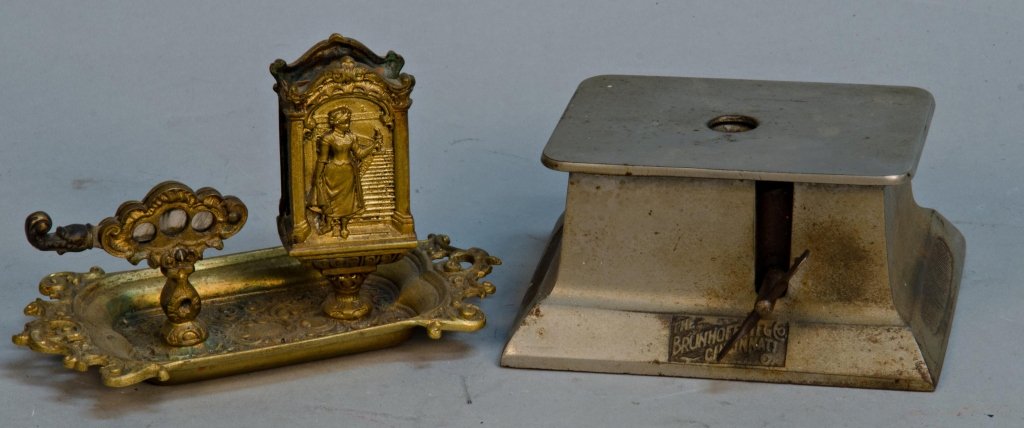 Lot Of 2 Early Cigar Cutter Items:: Lot Of 2 Early Cigar Cutter Items: 1 - Countertop Brunhoff MFG. Co. Cincinnati No. 422 All-Metal Automatic Clock Movement & 1 - Ornate Countertop Cigar Cutter And Match Holder Tray c1890