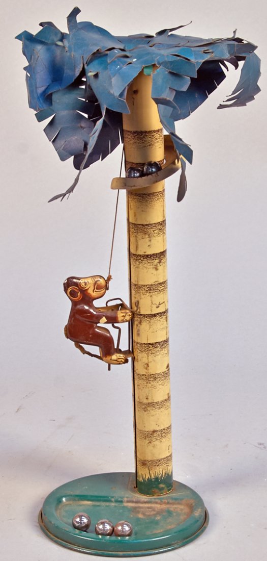 Vintage Emporium Specialty Co. Tin Monkey Climbing Palm: Vintage Emporium Specialty Co. Tin Monkey Climbing Palm Tree Toy, Litho. tin w/paper leaves & metal balls. Monkey climbs up and down tree for "coconuts", Monkey still has tail, c1940s
