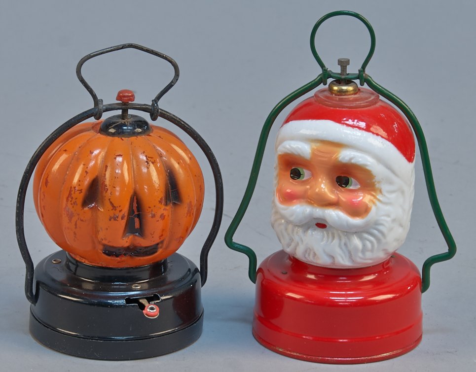 Lot Of 2 - Vintage Hand-Held Figural Lanterns:: Lot Of 2 - Vintage Hand-Held Figural Lanterns: 1 - Santa Claus' head, AAA Toys, Japan, tin base, battery op. - 6"h. & 1 - Jack-O-Lantern, tin base, battery op. - 5"h., both in great condition