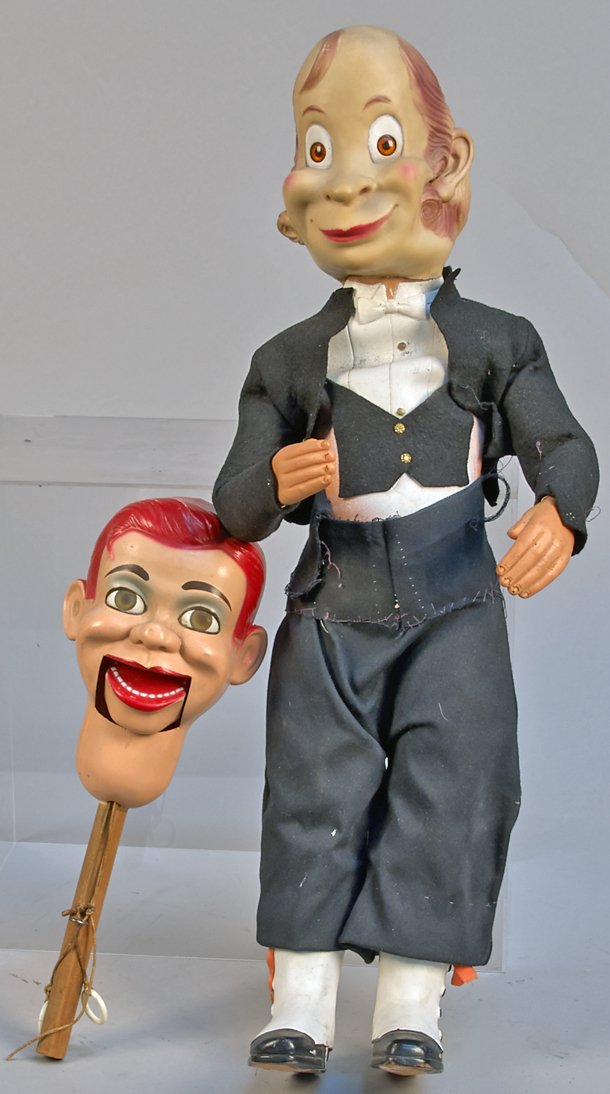Lot Of 2 Doll Items:: Lot of 2 Doll Items: 1 - Ventriloquist's dummy Jerry Mahoney head on wooden pole w/ pull strings for controlling mouth & 1 - Rubber butler doll, clothed in tuxedo