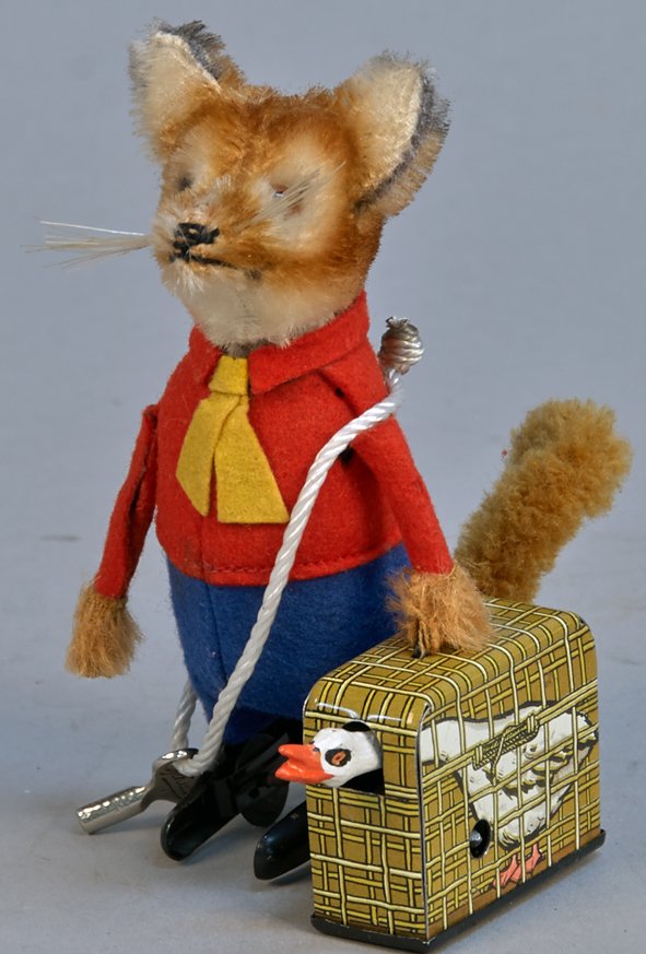 Fox Carrying Goose In A Cage: Fox Carrying Goose In A Cage, Schuco, Germany, c1950s, litho. tin, flock, fabric, wind-up - 5"h. The fully clothed fox is carrying the tin cage w/ goose, when fox walks & the goose's head bobs around,