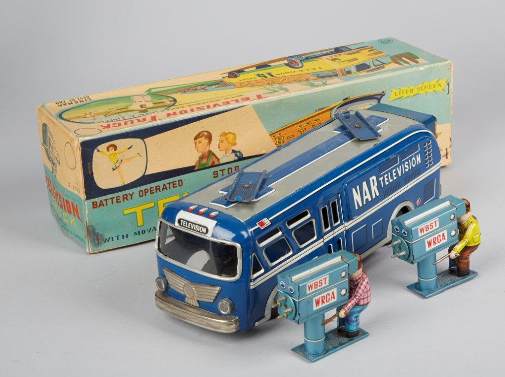 Television Truck With Moveable Cameramen & Cameras: Television Truck With Moveable Cameramen & Cameras, Made In Japan c1950s, litho. tin, battery op. - 11"l. "NAR Television", light-up back screen, stop & go action, in great condition w/ O.B. Very Rare