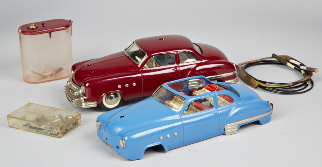 Schuco - 5311 Mk Deluxe - Ingenico 5311 Car Shells &: Schuco - 5311 Mk Deluxe - Ingenico 5311 Car Shells & Parts, Made In US-Zone Germany c1945-1952. Included a maroon saloon body shell & blue cabriolet body shell, baseplates, battery box, steering wheel
