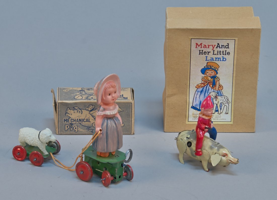 Lot Of 2 - Vintage Made In Japan Wind-Up Toys:: Lot Of 2 - Vintage Made In Japan Wind-Up Toys: 1 - celluliod clown figure riding tin pig w/ O.B. - 3" x 3" & 1 - "Mary And Her Little Lamb" celluloid figures on tin wheeled base w/ O.B. - 4-1/2"h., al