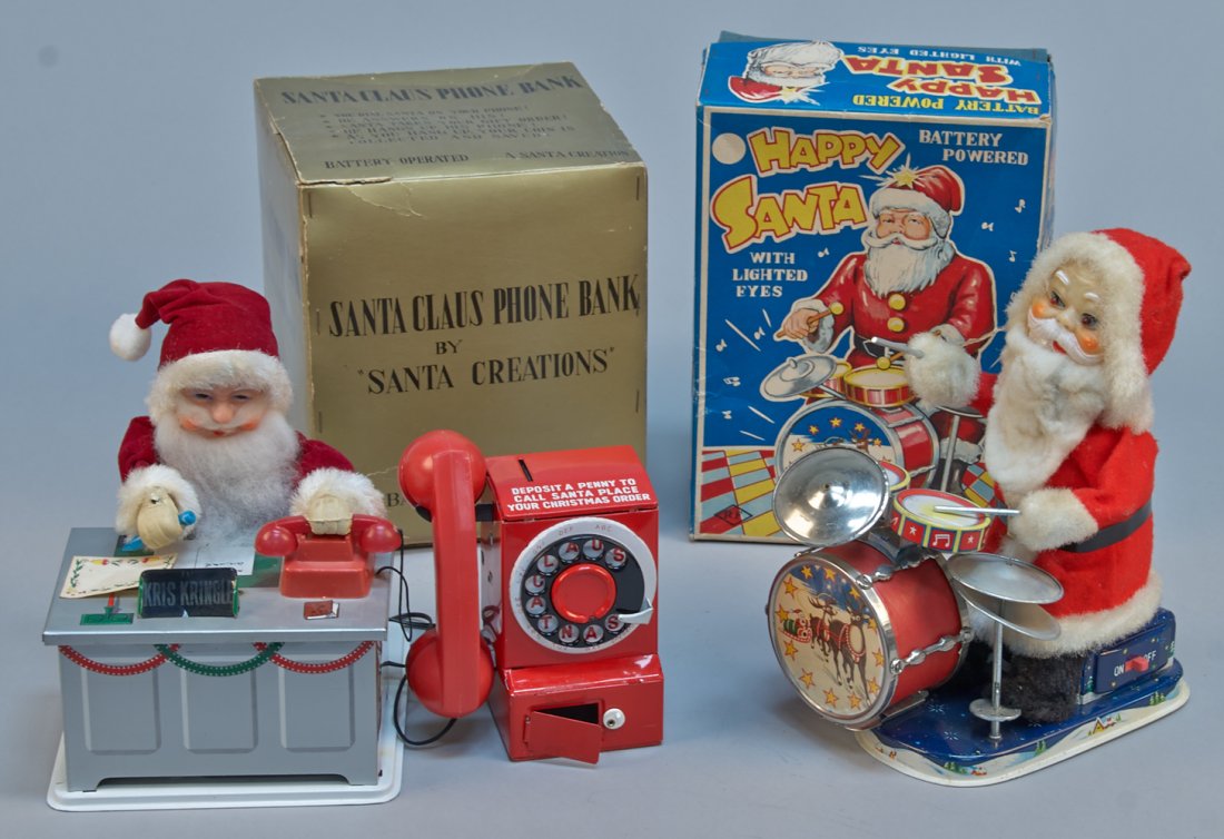 Lot of 2 - Vintage Made In Japan Santa Claus Toys:: Lot of 2 - Vintage Made in Japan Santa Claus Toys: 1 - Happy Santa With Lighted Eyes, litho. tin, battery op. - 9"h. & 1 - Santa Claus Phone Bank, litho. tin, battery op. - 7"h., both in excellent con