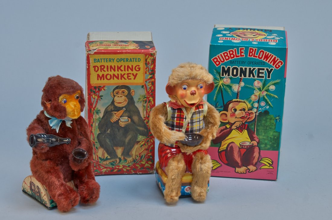 Lot of 2 - Vintage Made In Japan Monkey Toys:: Lot of 2 - Vintage Made in Japan Monkey Toys: 1 - Drinking Monkey, litho. tin, battery op. w/ light-up eyes - 10"h. & 1 - Bubble Blowing Monkey, litho. tin, battery op. w/ light-up eyes - 11"h., both