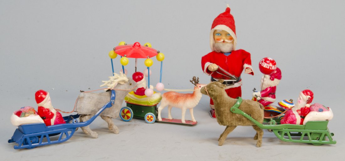 Lot Of 5 - Vintage Misc. Santa Claus Toys:: Lot Of 5 - Vintage Misc. Santa Claus Toys: 1- Santa Claus riding tricycle w/ bell, Made in Japan, c1960s, litho. tin, celluloid, wind-up - 5-1/2"h., 1- Reading Santa Claus, flips pages in book, Made i